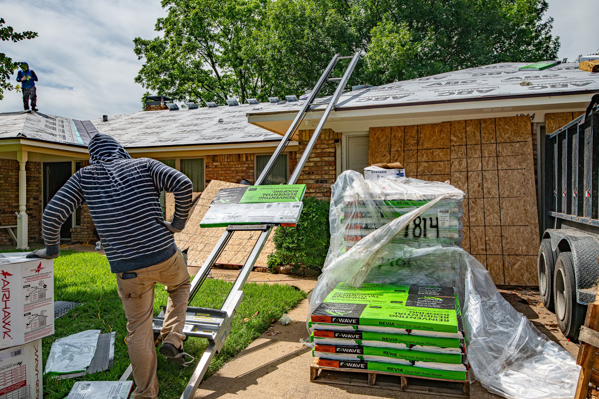 Texas Direct crew staging roofing materials at a DFW job site
