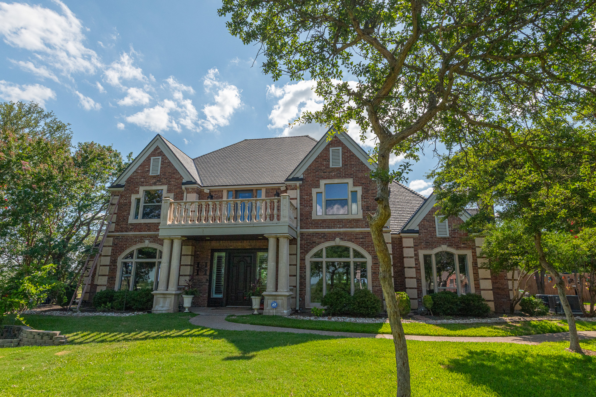 A replacement window installed by Texas Direct Roofing and Construction
